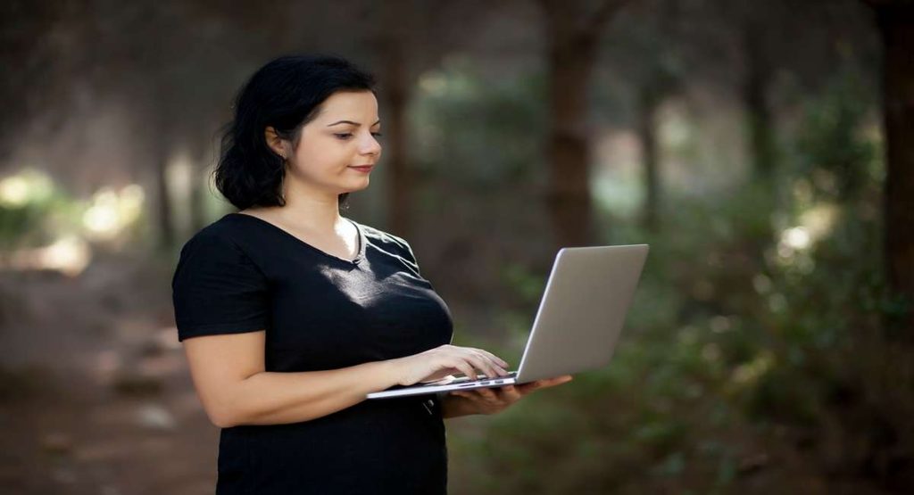 Freelance writer in Pakistan working remotely on a laptop